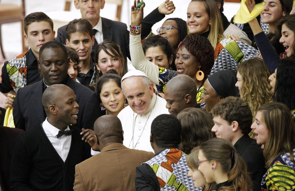 Pope Francis meets with members of the musical band of the FOCSIV Italian Catholic volunteers during a special audience he held at the Vatican on Thursday.