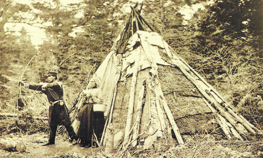 Micmac tribe members wearing unusual garb in 1873. Public Domain in the U.S.