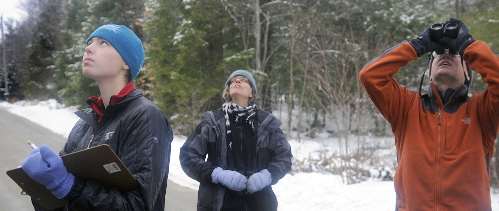 Anna Hodgkins, left, Tina Wood and Hodgkins’ father, Glenn, record birds in Farmingdale while participating in the annual Christmas Bird Count on Sunday. 