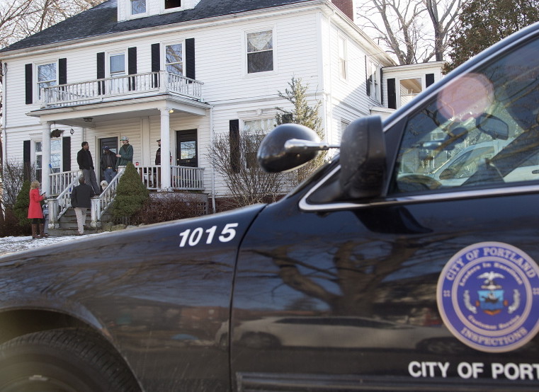 A city vehicle is parked outside 186-188 Dartmouth St.  during a recent safety inspection of the two-unit rental property. Another duplex owned by Gregory Nisbet burned Nov. 1, killing six people.