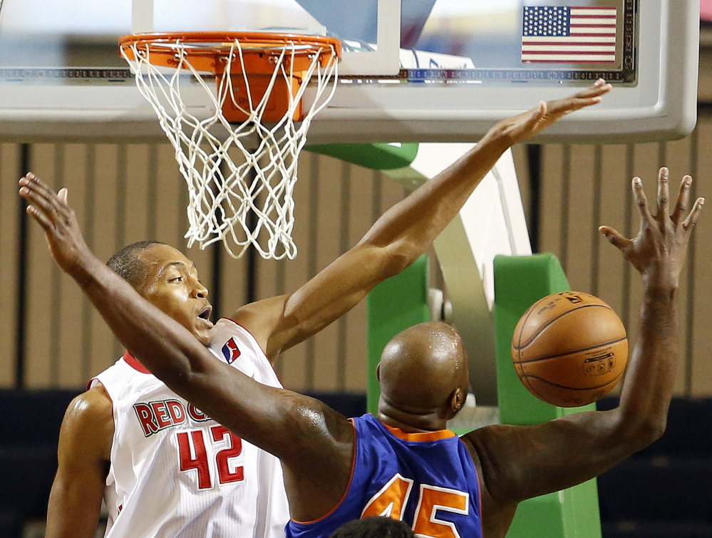 Maine’s Asauhn Dixon-Tatum battles for a rebound with Westchester’s Darnell Jackson during their game Saturday at the Portland Expo. Dixon-Tatum and Ralph Sampson III have filled the rebounding void left by trades and injuries.