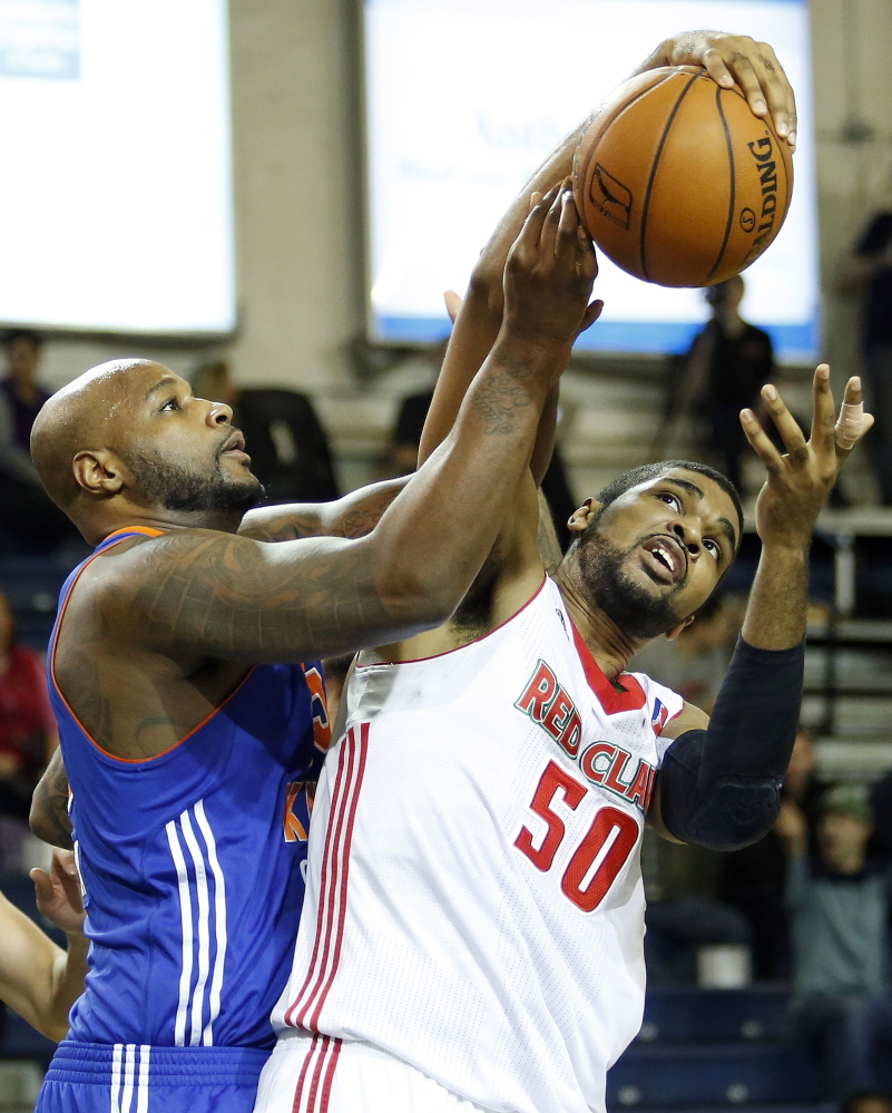 Maine’s Ralph Sampson III, right, battles Westchester’s Darnell Jackson for a rebound during their game Saturday in Portland. Sampson made two free throws with 20 seconds left to help the Red Claws secure the victory.