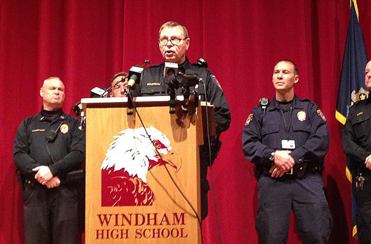 Windham police Lt. Jim Boudreau  announces details of the case at a news conference at the high school Wednesday morning.. He said the suspect  is charged with one count of felony terrorizing for each school that was shut down. Photo by Gillian Graham / Staff Writer