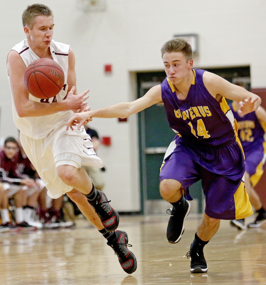 Gorham's Billy Ruby tries to secure the ball on a fast break as Luca Napolitano of Cheverus tries to steal. 
Gabe Souza/Staff Photographer