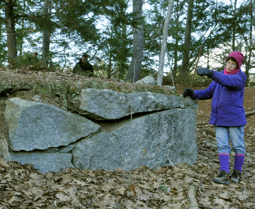 Anne Cough leads a tour of the Edgecomb family cemetery in Gardiner, which has fallen into disrepair. The city is required to care for two veterans’ graves at the site.