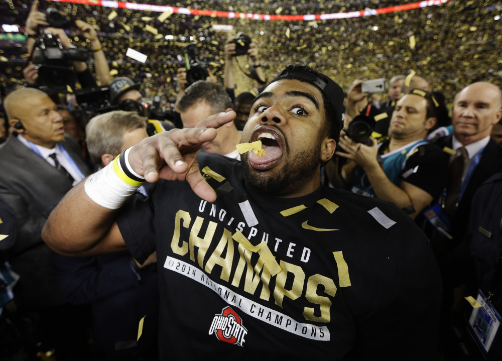Ohio State running back Ezekiel Elliott celebrates after the Buckeyes won the national championship against Oregon on Monday night in Arlington, Texas. Elliott rushed for 246 yards and four touchdowns in the game.