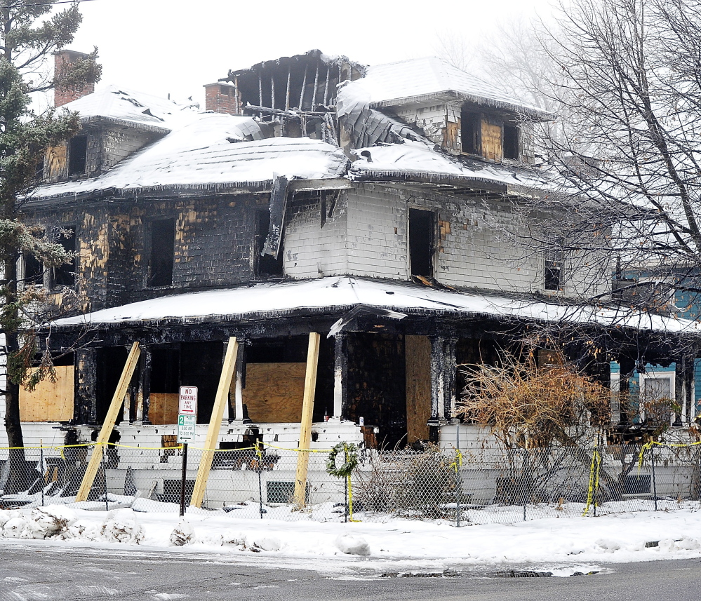 Six people died from the fire that swept through this apartment house on Noyes Street in Portland in early November. The city has issued a permit to demolish the structure.