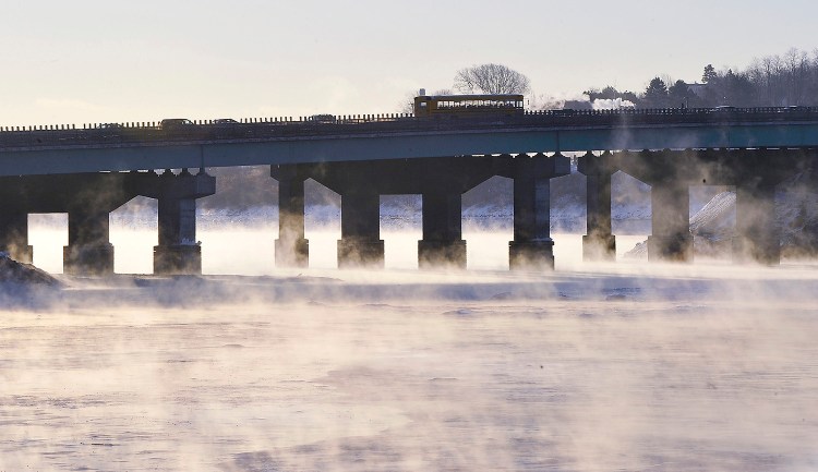 Drivers head into the Portland area over Tukey's Bridge as sea smoke rises from the Back Cove. 
Gordon Chibroski/Staff Photographer