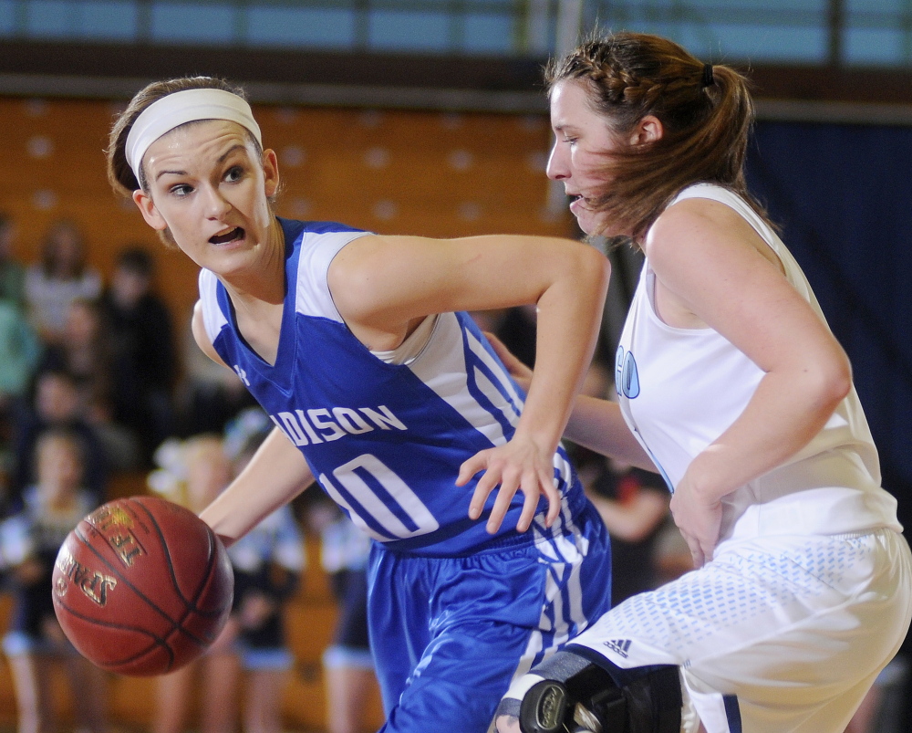 Madison’s Kayla Bess dribbles around Dirigo’s Mackenzie Abbot during a Western C semifinal Friday at the Augusta Civic Center.