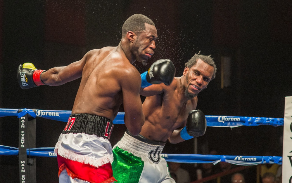 Russell Lamour, left, takes a left from Thomas Falowo during their fight for the New England middleweight title Friday night at Foxwoods Resort Casino in Mashantucket, Connecticut. Lamour lost the fight by unanimous decision, 78-74, 77-75, 77-75.