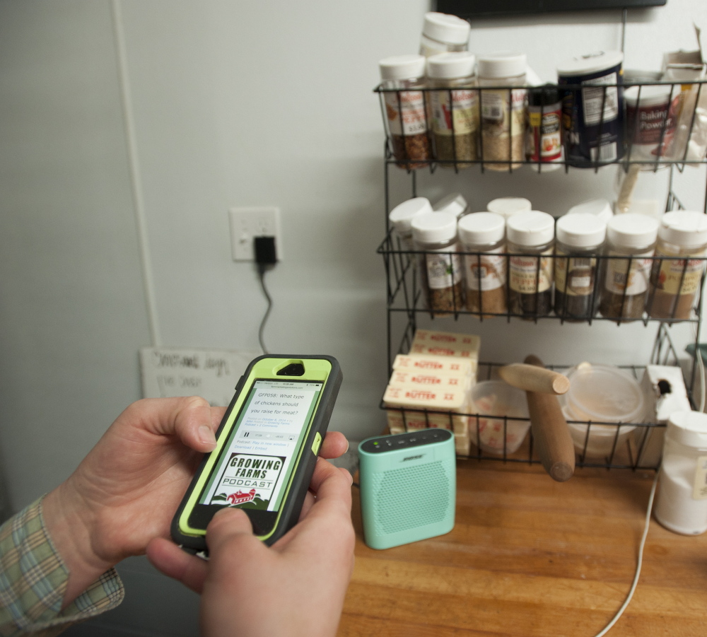 Natasha Colbry pulls up a podcast about farming that she listens to while baking in the commercial kitchen she and her husband have created in the garage of their home at Spruce Mill Farm in Dover-Foxcroft. The Colbrys are experiencing problems with Internet connectivity as they run their farming enterprises.