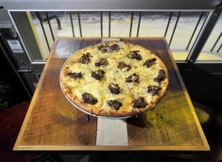 A pulled pork and mango pizza at Otto in South Portland.