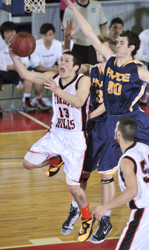 Forest Hills senior guard Matthew Turner, left, takes a shot over Hyde junior forward Andrew Palermo during the Western Class D championship game Saturday at the Augusta Civic Center. Turner scored 10 points for the Tigers.