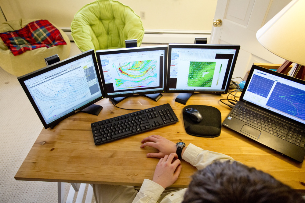 Jack Sillin, 13, checks weather models in his Yarmouth home Friday. Among friends at school and on his blog, he’s known as Forecaster Jack, Snow Day Jack, or Our Snow Day Hero. Teachers, students, and even the headmaster at North Yarmouth Academy turn to him to find out if a snow day is likely.