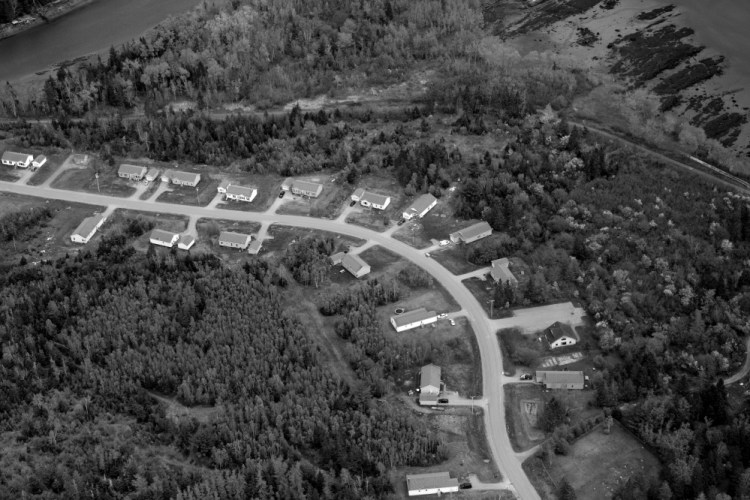 Federally funded Housing and Urban Development homes line a stretch of road on the Pleasant Point Indian Reservation in eastern Washington County. The reservation faces a $54,696 cut in General Assistance, or $73 per person, under the governor’s reform plan.