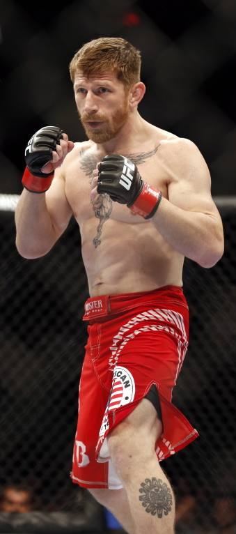 Mike Brown, who had a successful career as a mixed martial arts fighter, still spends much of his time at the gym, but now as a coach.