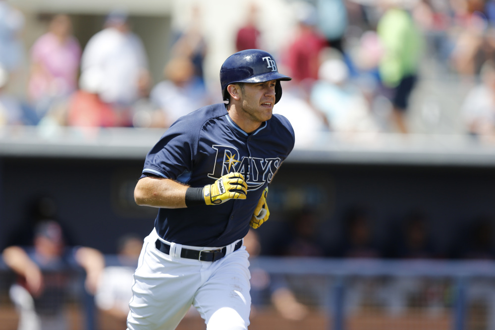 Tampa Bay Rays’ Evan Longoria runs toward first base after hitting a single in the fourth inning against the Boston Red Sox on Saturday.
