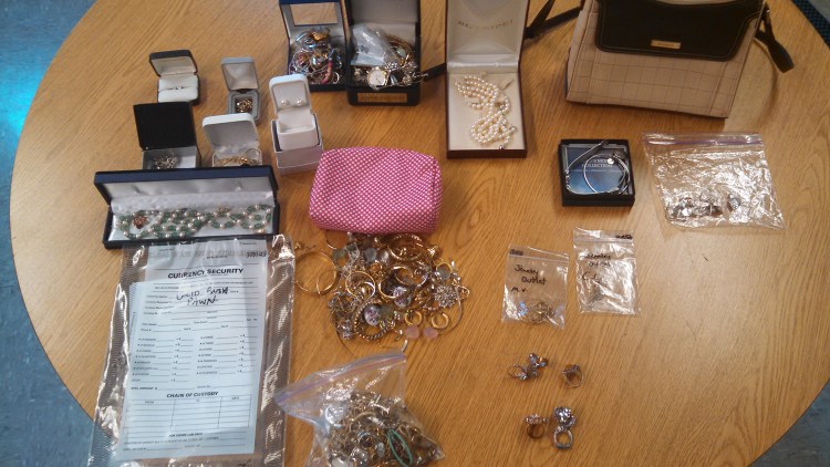 Police display some of the items recovered after the arrests of four York County residents on burglary charges.