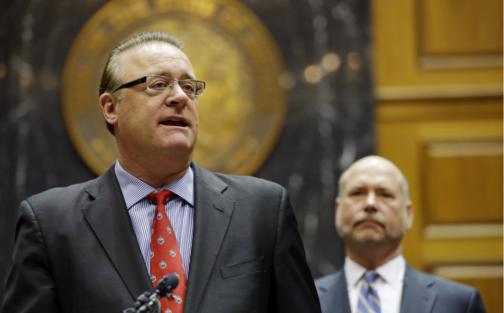 Indiana Senate President Pro Tem David Long, left, R-Fort Wayne, and House Speaker Brian C. Bosma, R-Indianapolis, announce changes to the state’s new religious objections law during a news conference in the House chamber at the Statehouse in Indianapolis on Thursday before lawmakers passed the changes.