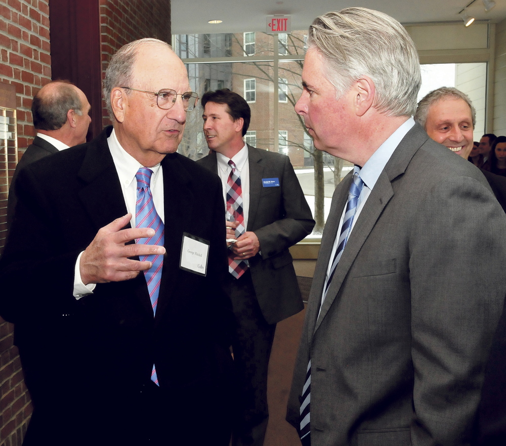 Former U.S. Sen. George Mitchell, left, chats with Colby College President David Greene prior to U.S. Sen. Susan Collins address in Waterville on Thursday.