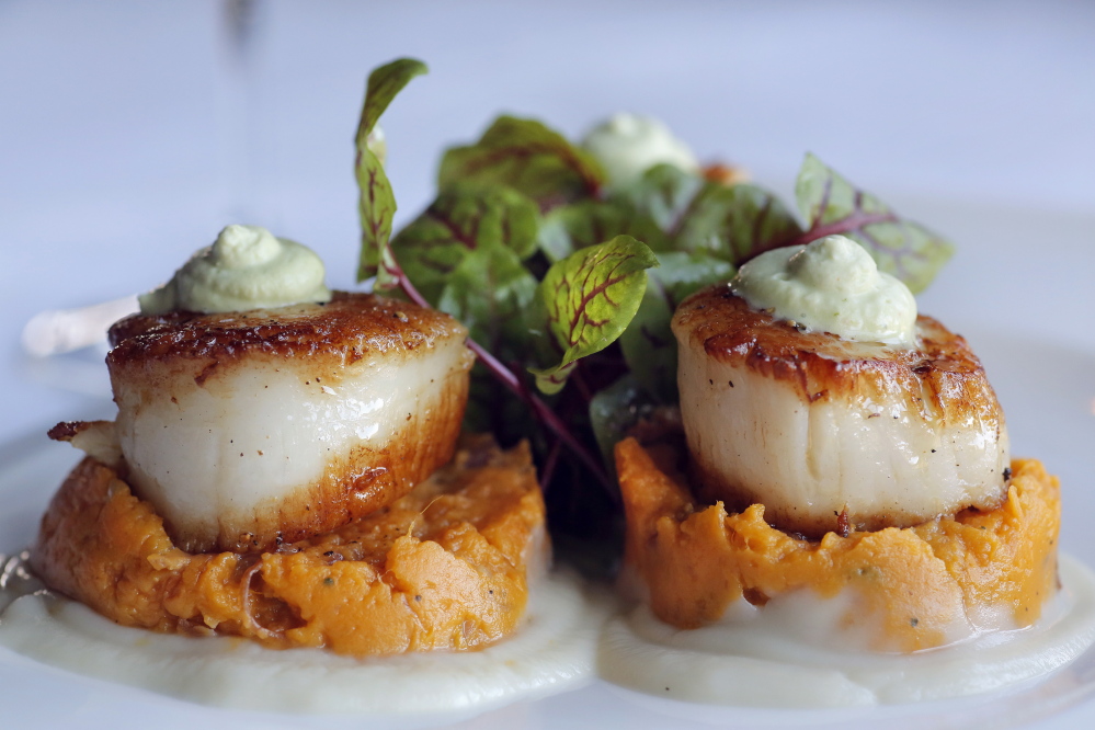 The entree of pan-seared scallops.