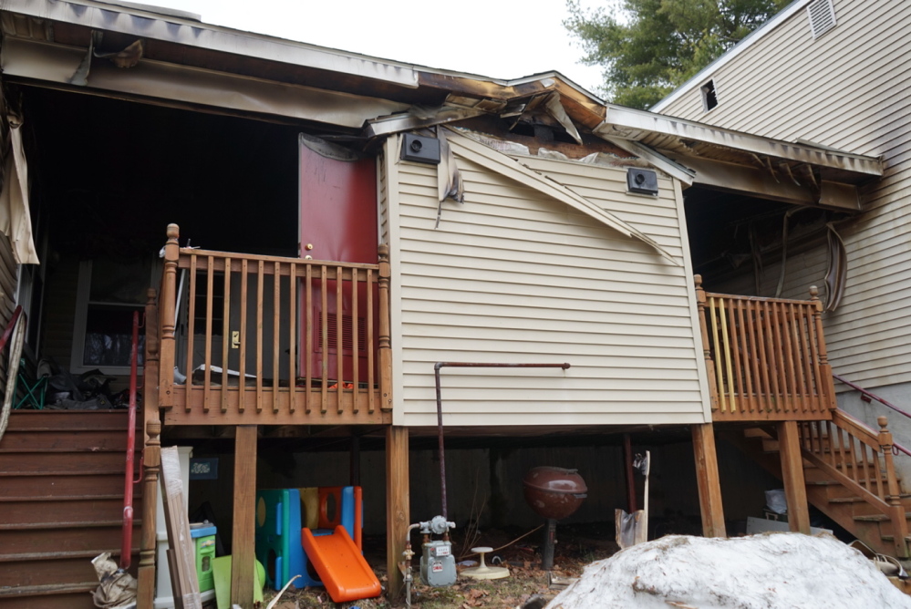 The back porches and an electrical utility room show burn marks after a Sunday night fire at 70 Grandview Ave. in South Portland.