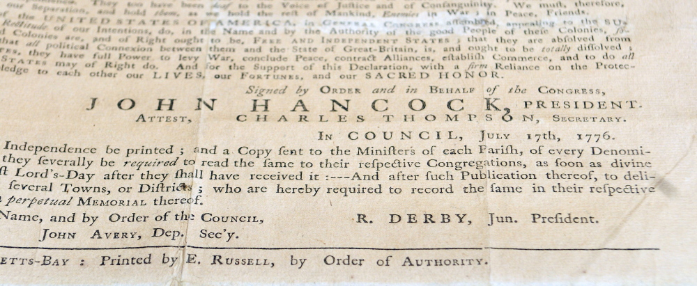 John Hancock’s name is seen in large print at the bottom of a 1776 copy of the Declaration of Independence at the Maine State Museum in Augusta.