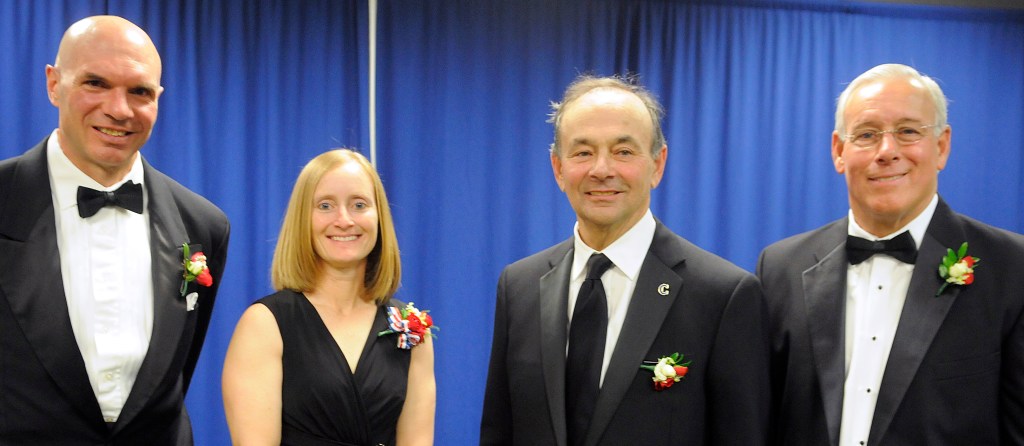 From left, Eric Weinrich (hockey), Marcie Lane Schulenberg (basketball), William Alfond (philanthropist) and Glenn Dumont (football) were among nine inductees Sunday into the Maine Sports Hall of Fame. Andy Molloy/Kennebec Journal
