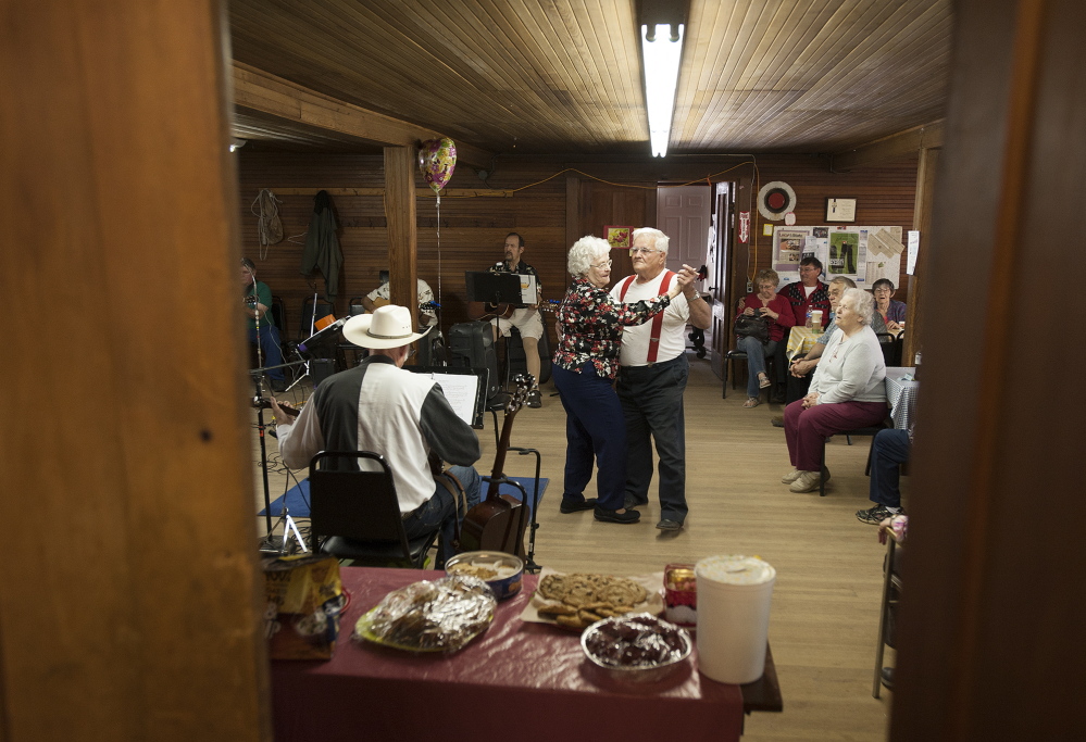 Hugh Start of Warren and Colleen Cox of Jefferson dance to country music at the Chelsea Grange on Sunday afternoon.