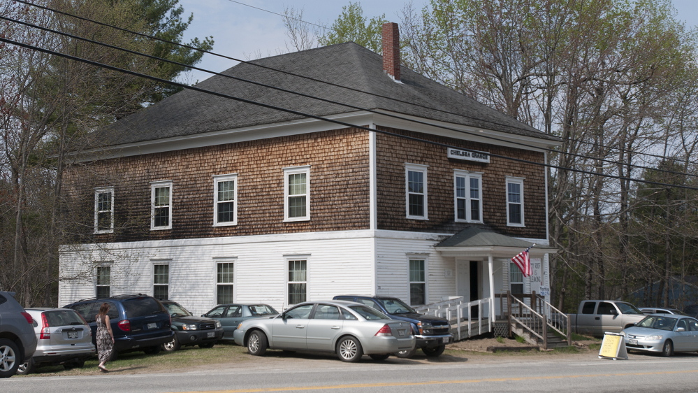 The parking lot at the Chelsea Grange Hall is full as people gather to listen to country music and enjoy snacks on Sunday afternoon. Donations for snacks are earmarked to pay for replacement of the roof.