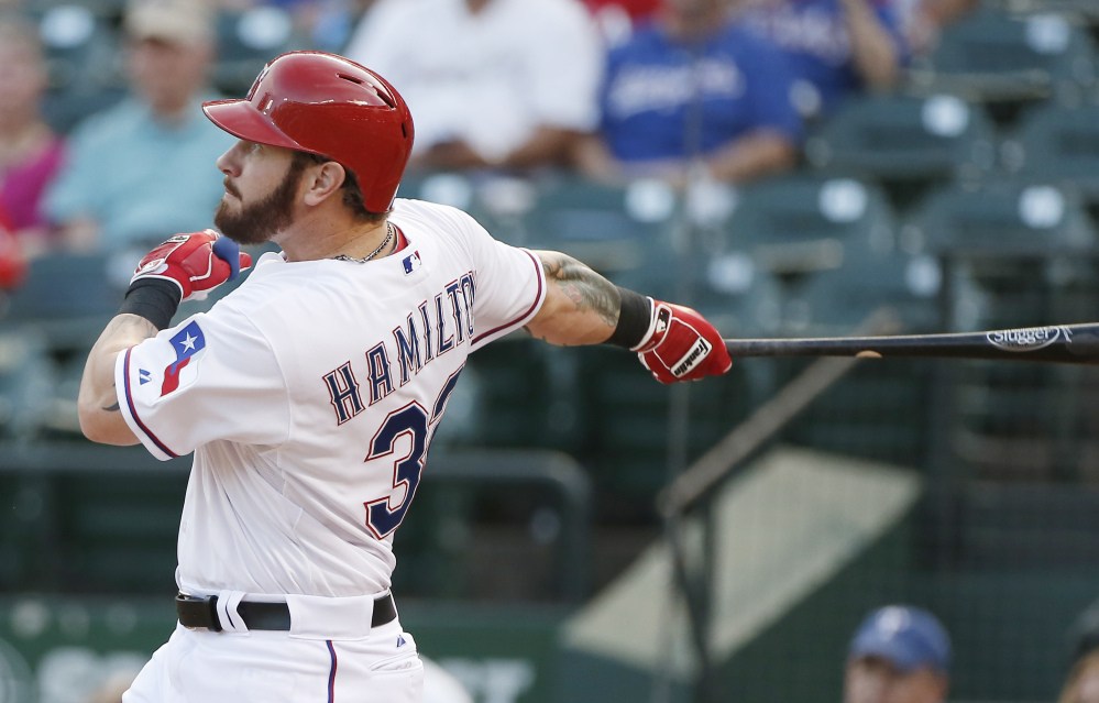 The Texas Rangers’ Josh Hamilton hits a solo home run during the second inning Friday night against the Red Sox, who have won just one of five games on their current road trip. Hamilton hit another home run in the fourth inning.