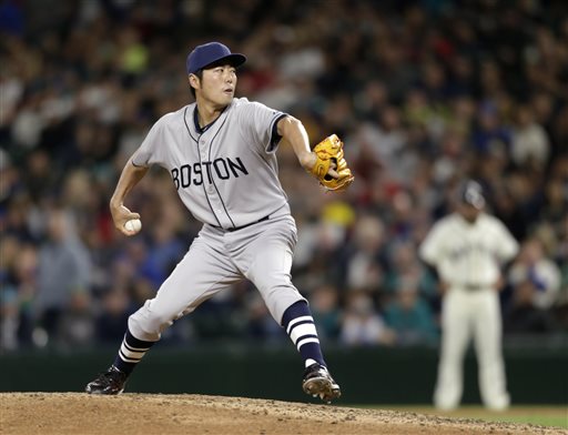 Red Sox closer Koji Uehara works against the Seattle Mariners in the ninth inning Saturday in Seattle. The Red Sox won 4-2. The Associated Press