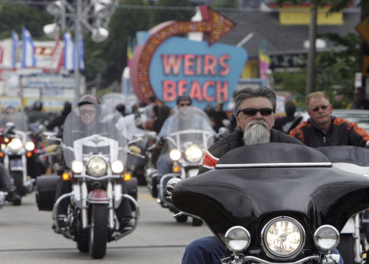 Bikers arrive at Weirs Beach in Laconia, N.H., for bike week in 2010.