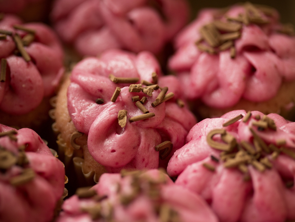 The chocolate variety tops strawberry cupcakes.