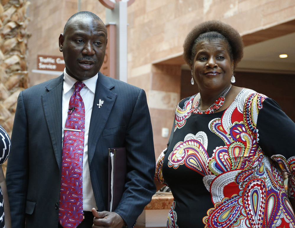 Attorney Benjamin Crump stands with Karen Williams, who contends B.B. King’s business manager looted his accounts and hastened the blues legend’s death.