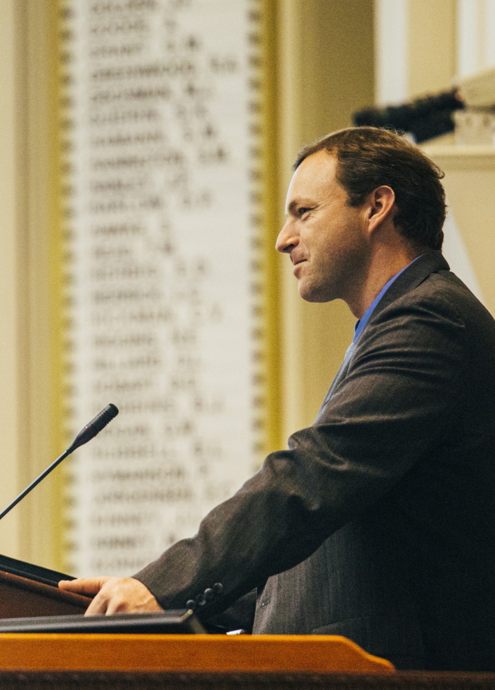 House Speaker Mark Eves oversees a legislative session Tuesday at the State House in Augusta. He is weighing a lawsuit against the governor.