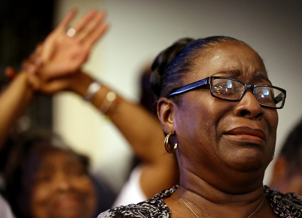 The Rev. Jeannie Smalls cries during a prayer vigil held Thursday at Morris Brown AME Church for the victims of Wednesday's shooting at Emanuel AME Church in Charleston, S.C.  