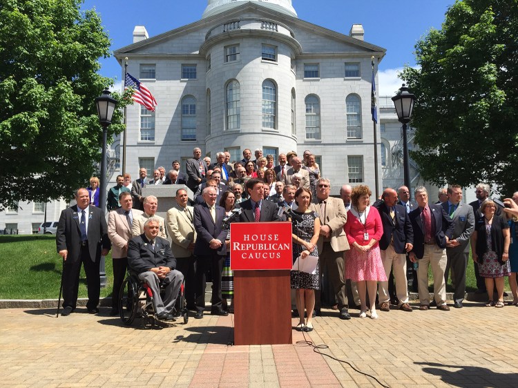 House Minority Leader Kenneth Fredette, R-Newport, is joined by most members of the House Republican caucus Wednesday during one of several dueling press conferences on the state budget. Negotiations faltered Wednesday after the opposing sides appeared to be closing in on a deal just a day earlier.