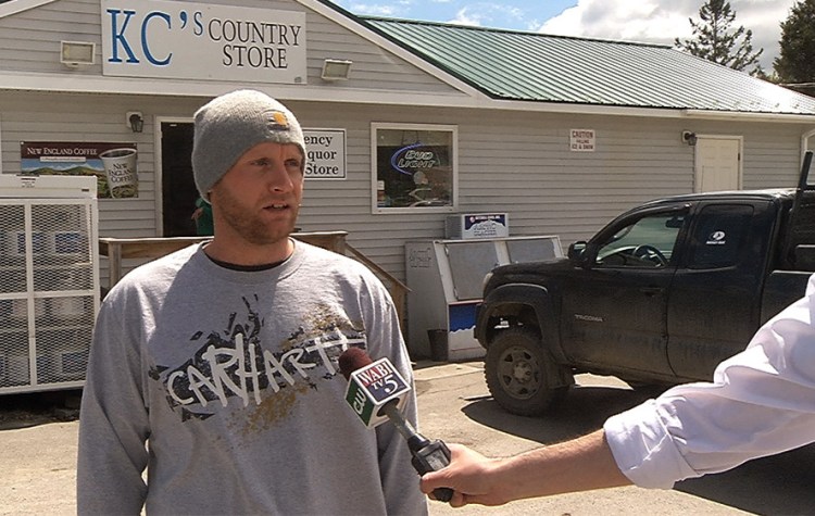 Robert Burton, shown giving a TV interview shortly after the discovery of the body of his girlfriend in her Parkman home in June, has turned himself in to police.