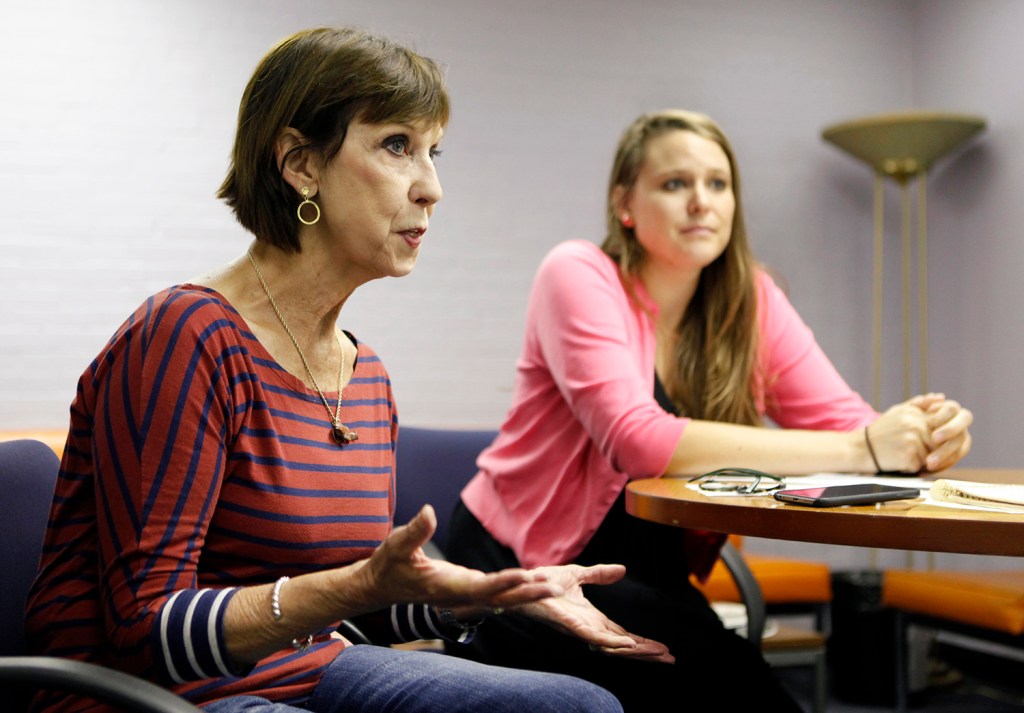 Caroline Teschke, left, joined by Community Health Promotion Specialist Lizzy Garnatz, right, speaks about the needle exchange program Thursday, July 2 at the India Street Public Health Center in Portland, Maine.  Joel Page/Staff Photographer