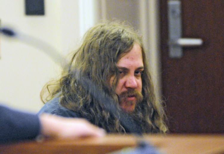 Eric Bard, 26, of Sidney, listens to testimony during a hearing on Friday in the Capital Judicial Center in Augusta.