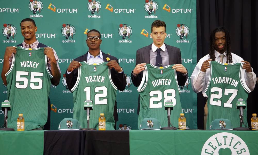 Boston Celtics draft picks Jordan Mickey, from left, Terry Rozier, R.J. Hunter and Marcus Thornton are introduced to the media at the Celtics basketball training facility Tuesday in Waltham, Mass.
The Associated Press