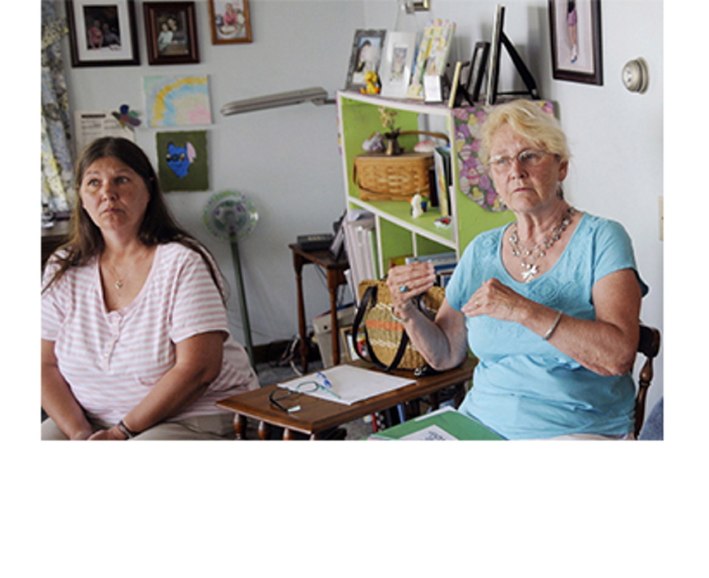 Brenda Beaulieu, left, of Fairfield listens as Jan Strout of West Gardiner speaks during a recent Augusta Area Kinship Support group meeting. Lacking state support and often financially strapped, Maine grandparents raising their grandchildren have been selling baked goods and holding yard sales to help each other out.