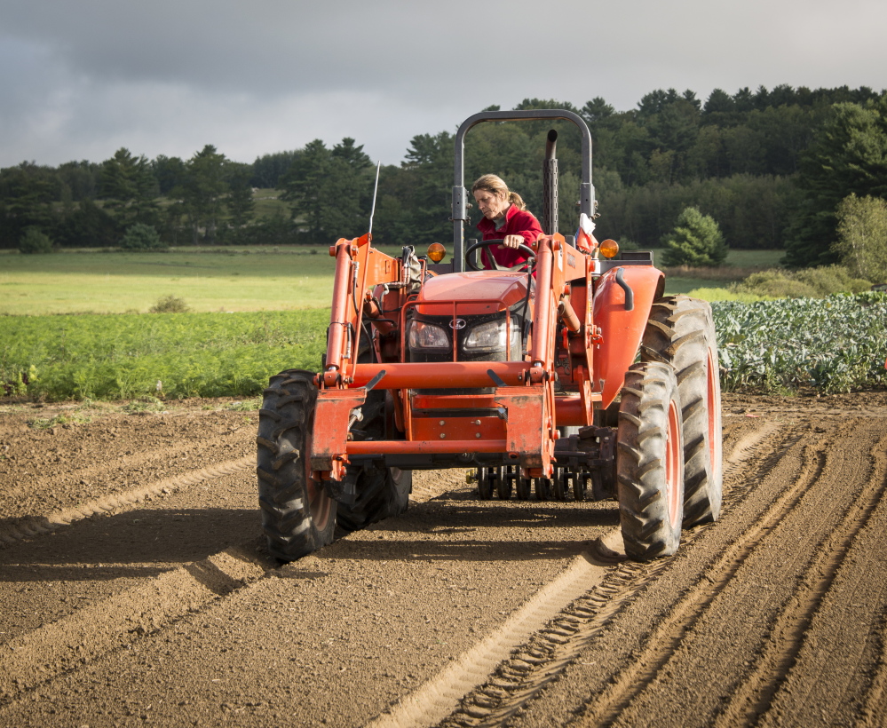 Seeding at Goranson Farm in Dresden, one of the six Maine farms featured in Peter Felsenthal’s book of interrviews and photos, “New Growth.”