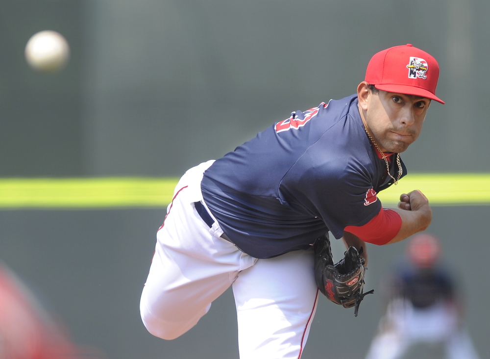 Portland relief pitcher Jorge Marban fires his pitch to the Mets batter as the Portland Sea Dogs host the Binghamton Mets at Hadlock Field on Monday.