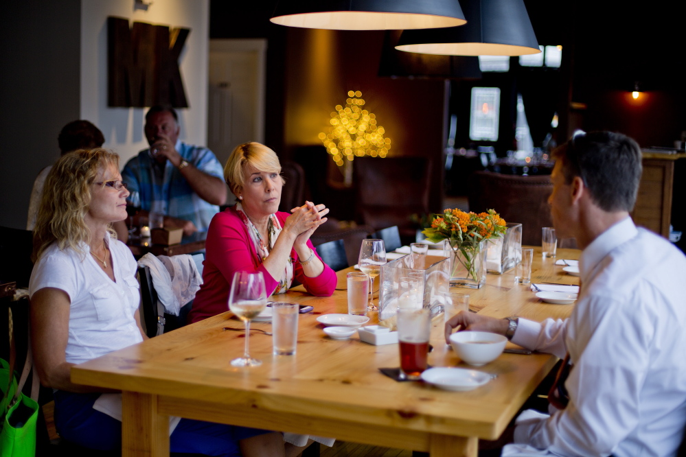 Theresa Hartman, left, and Leslie Finkelstein of Baltimore dine with Joel Shinofield of Norfolk, Va., at MK Kitchen in the center of Gorham.