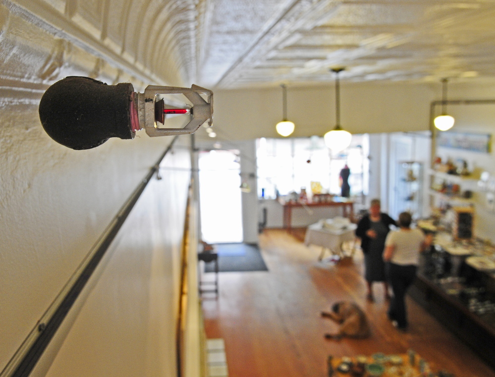 A sprinkler head in front of a stamped metal ceiling is seen in a photo taken on Thursday at Monkitree gallery in Gardiner.