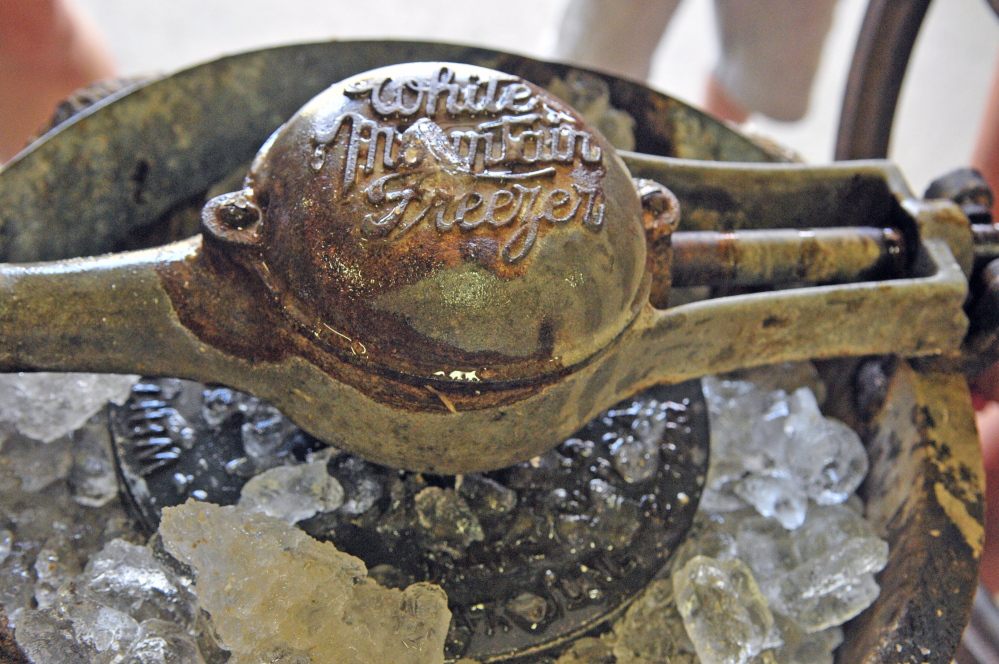 This antique ice cream machine provides quality entertainment for children at the fair. It also allows them to turn back the clock.