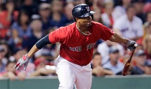 Red Sox shortstop Xander Bogaerts watches his single, which drove in Mookie Betts with the winning run in the 11th inning against the Detroit Tigers at Fenway Park in Boston on Friday. The Associated Press