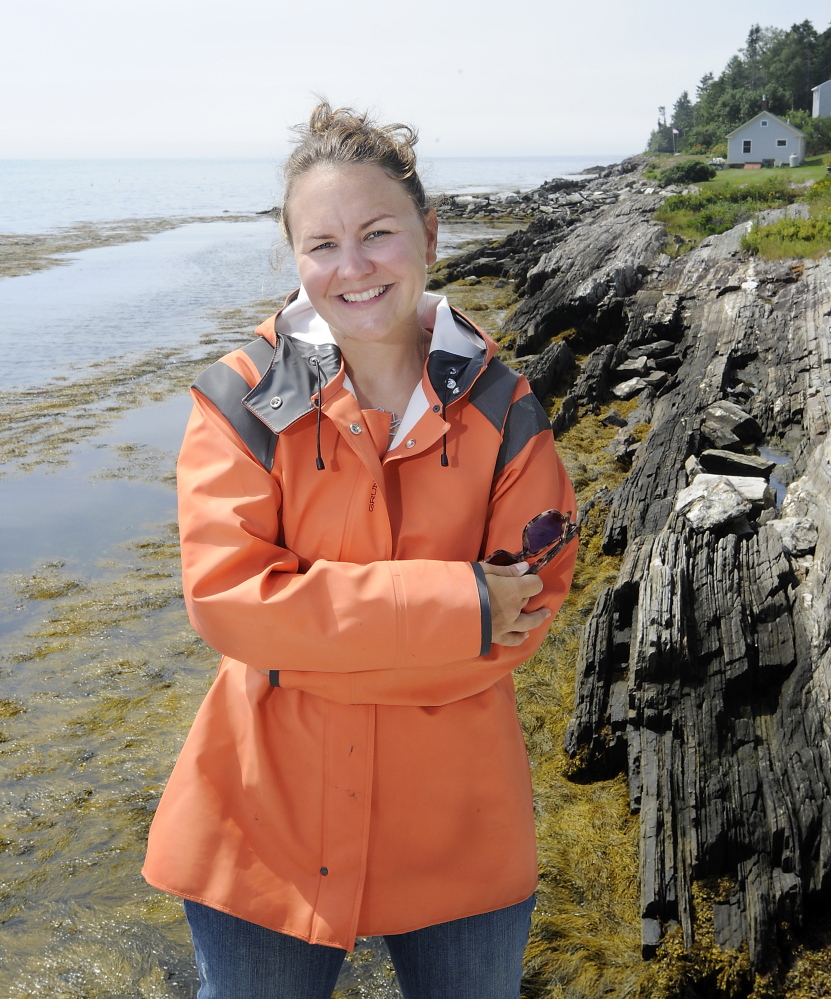 Monique Coombs on the wharf near her Orr’s Island home.